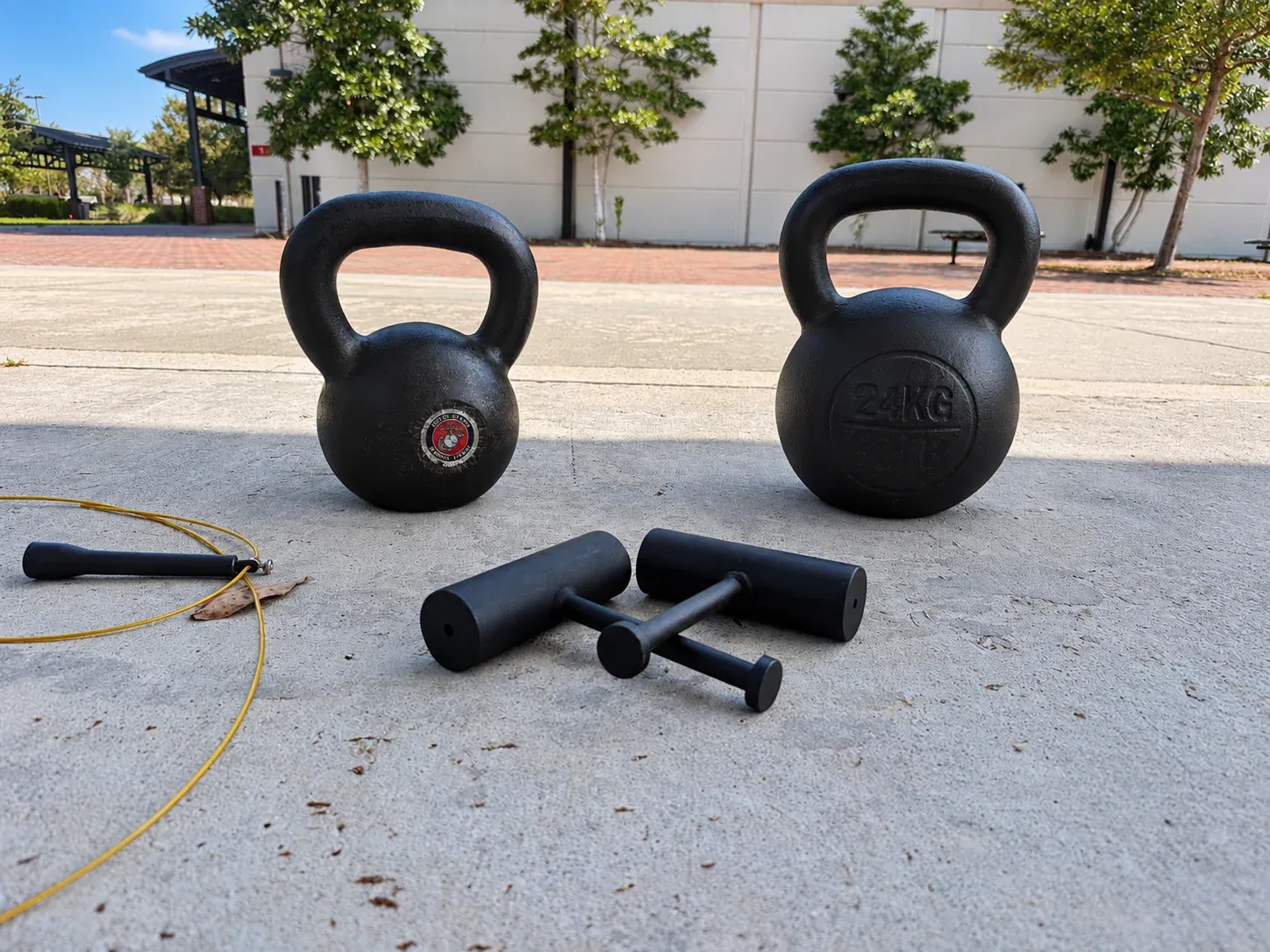 Kettlebells and movement equipment arranged outdoors